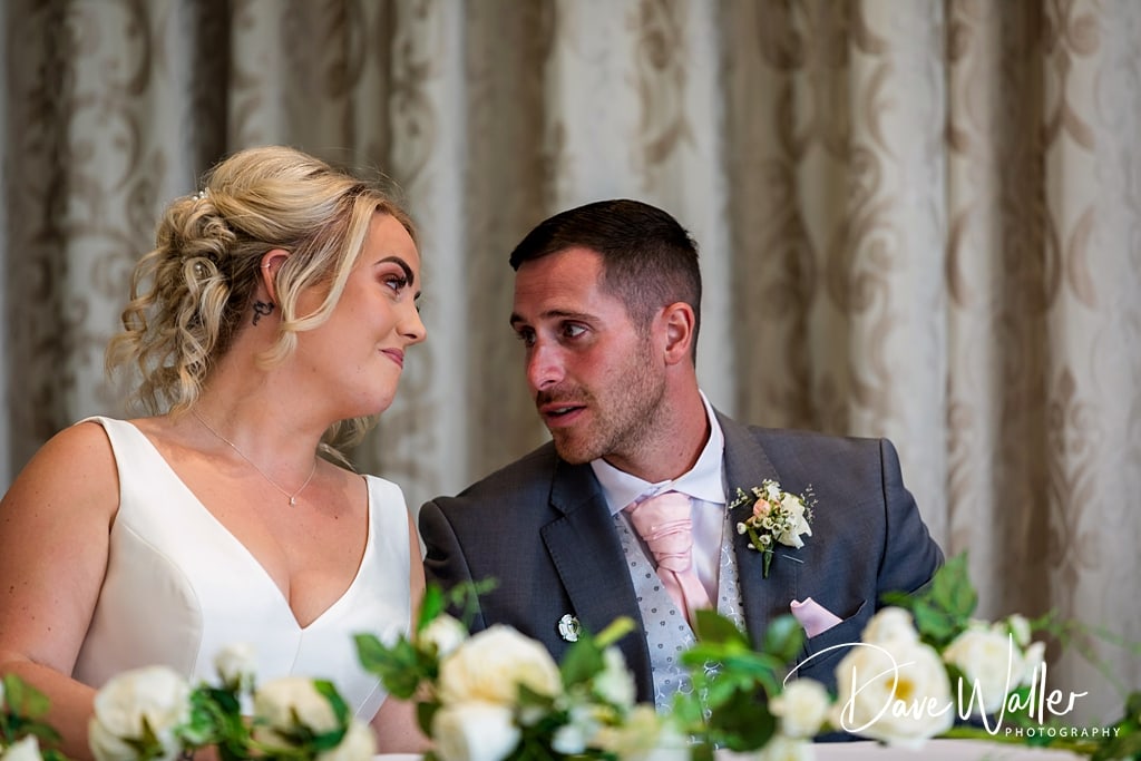 The joy of celebration captured in black and white at Sophie & Nicholas' wedding: couples share loving dances in the warm glow of a festive occasion at Hollins Hall Hotel.