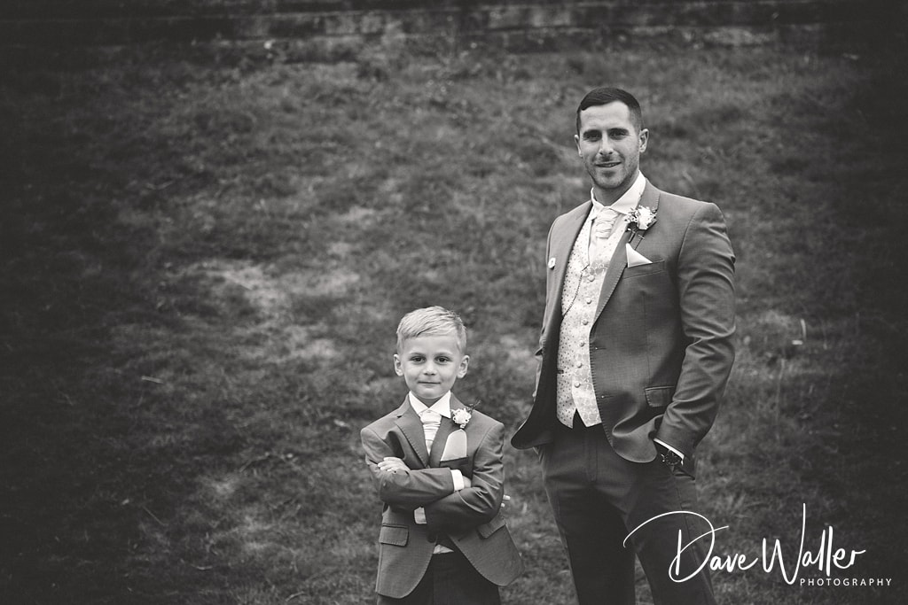 Monochrome elegance at Hollins Hall Hotel: a proud moment shared between two dapper gentlemen, Sophie & Nicholas.