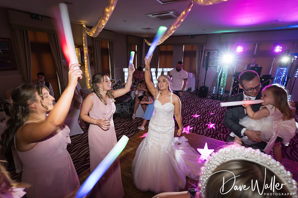 Wedding reception dance with colourful glow sticks.