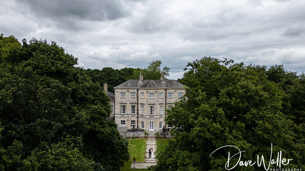 Grand estate surrounded by lush green trees