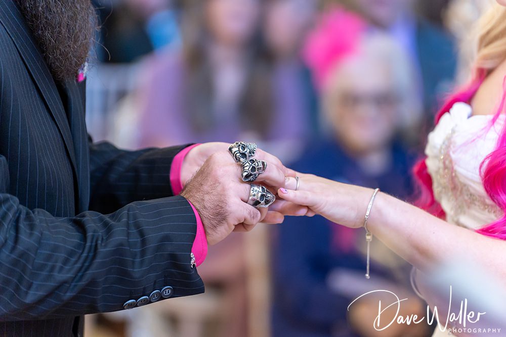 Gothic wedding ceremony with unique skull rings exchange.