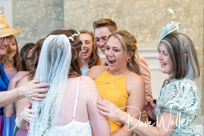 Group celebrating at a wedding reception.