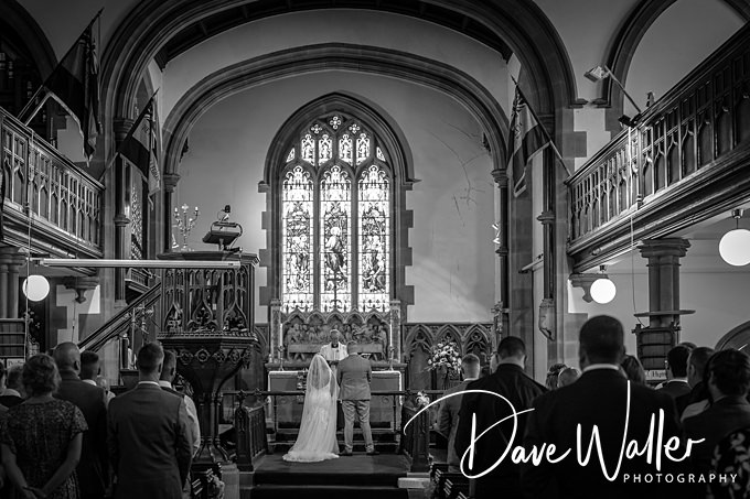 Couple getting married in a church ceremony.