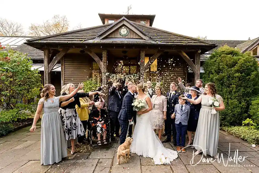 Group celebration at rustic wedding venue