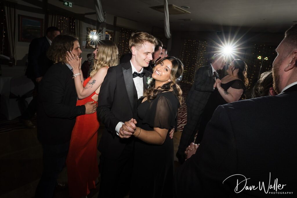 Couples dancing at elegant evening wedding reception