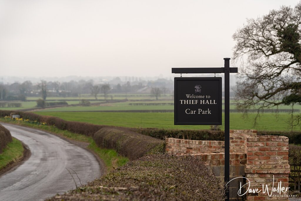 Thief Hall car park sign, countryside view