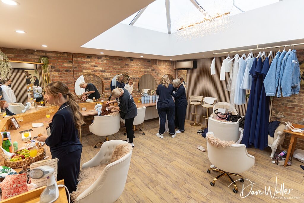 Women getting ready in a dressing room.