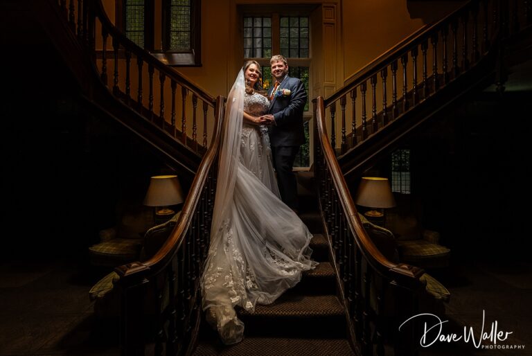 Bride and groom on grand staircase