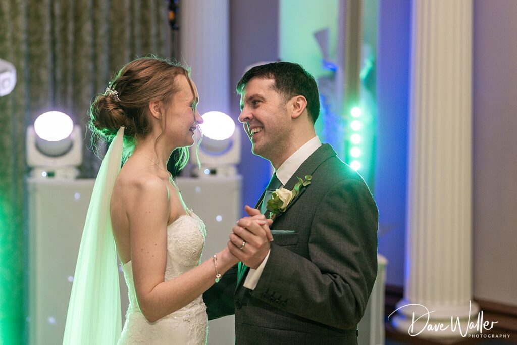 Bride and groom dancing at wedding reception