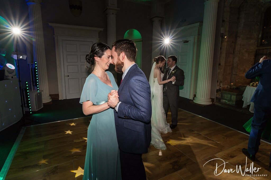 Couples dancing at a wedding reception.