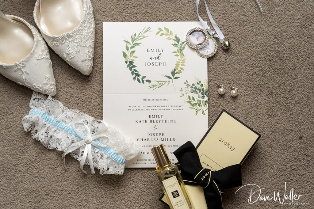 Wedding invitation with shoes and accessories.
