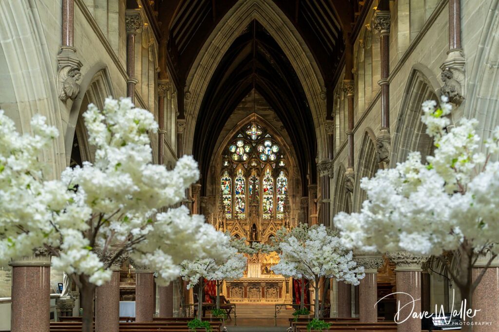 Historic church interior with stained glass windows.
