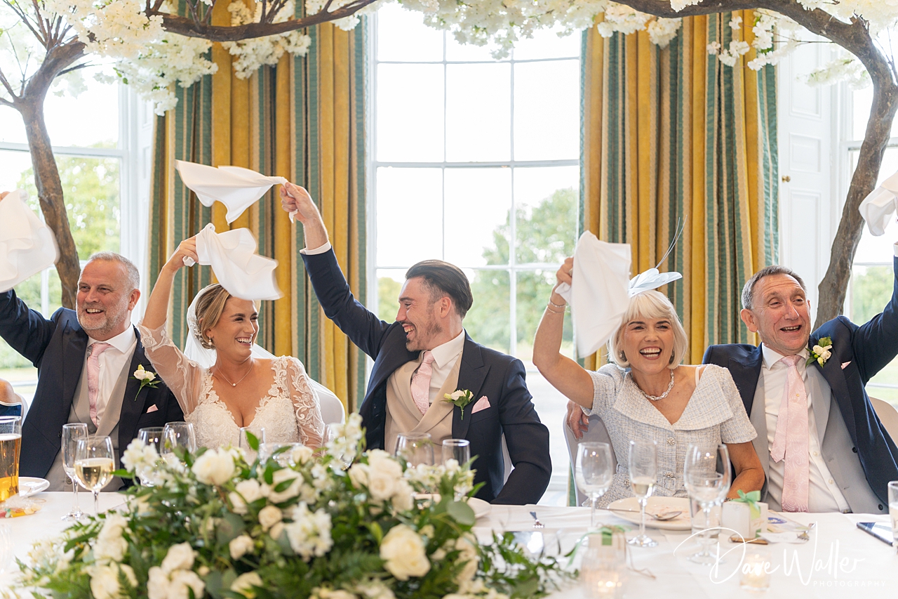 Joyful wedding reception celebration scene.