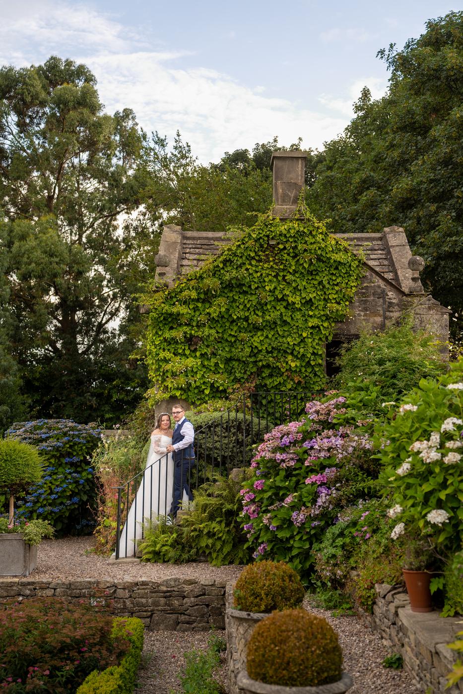 Shannon and Scott in the terraced gardens below the ivy-covered Holdsworth House