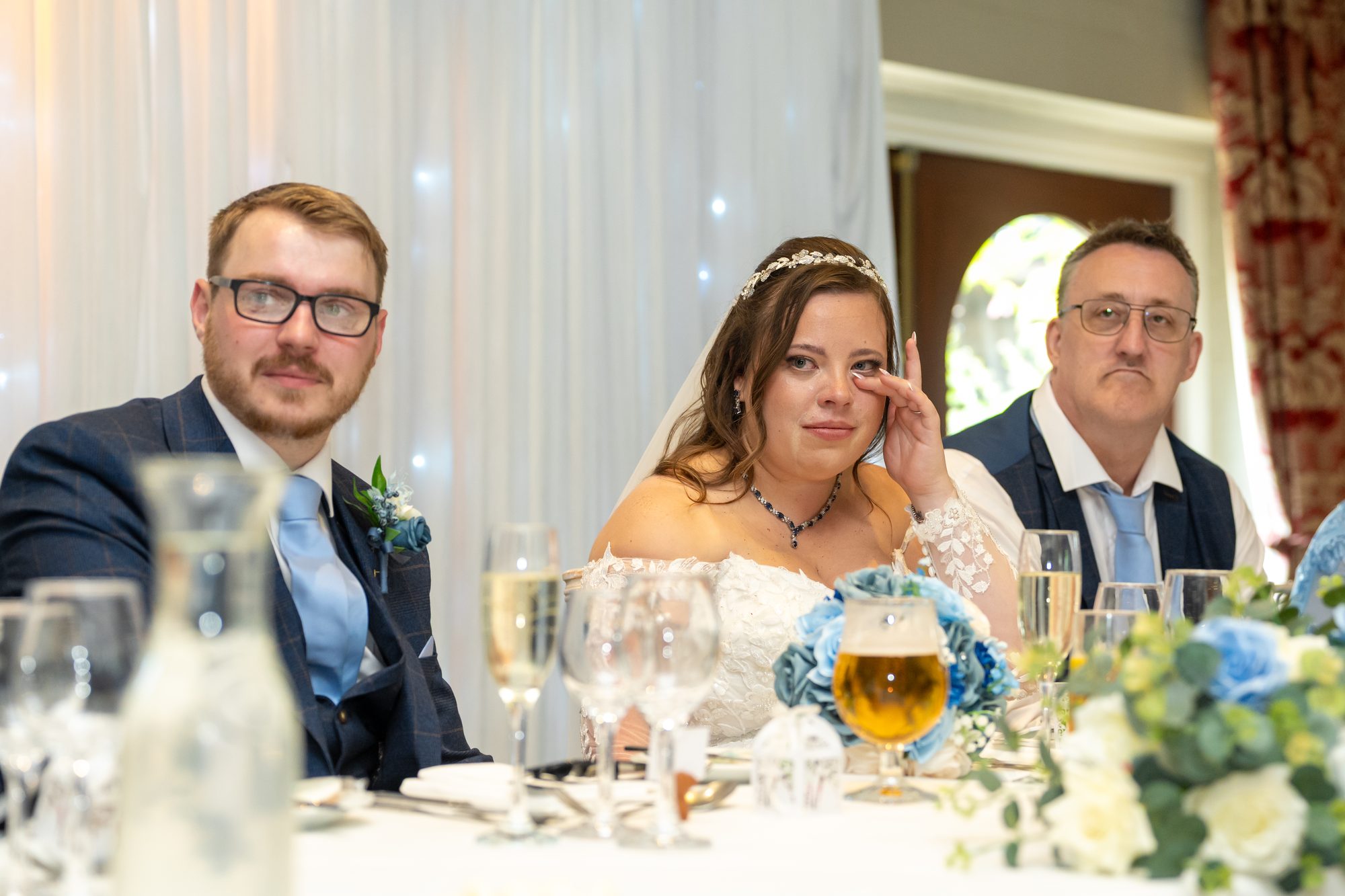 Shannon and Scott laughing at the top table during the speeches