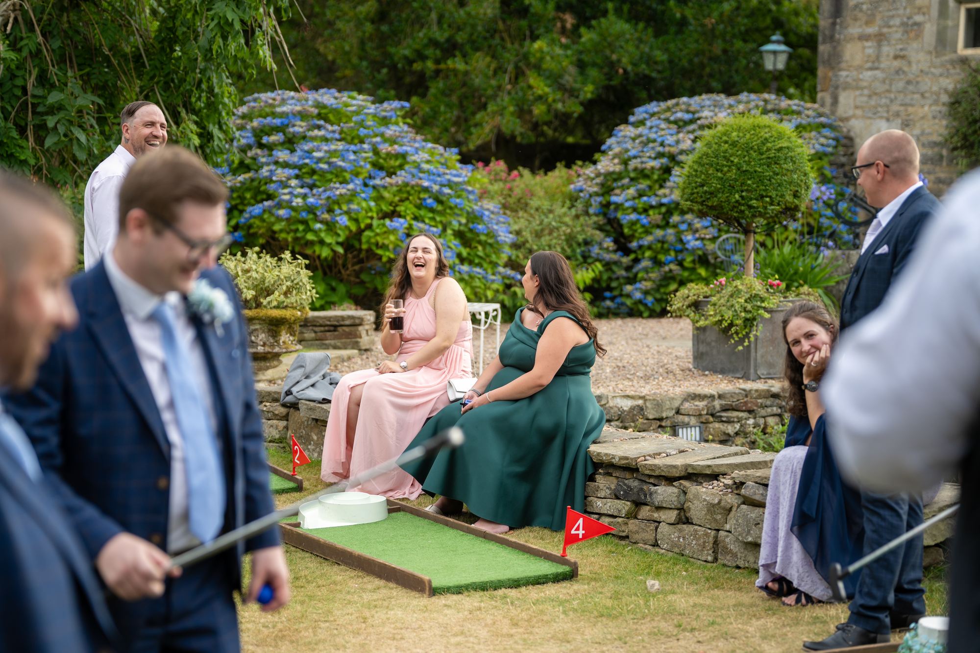 Guests playing mini golf in the gardens during the drinks reception