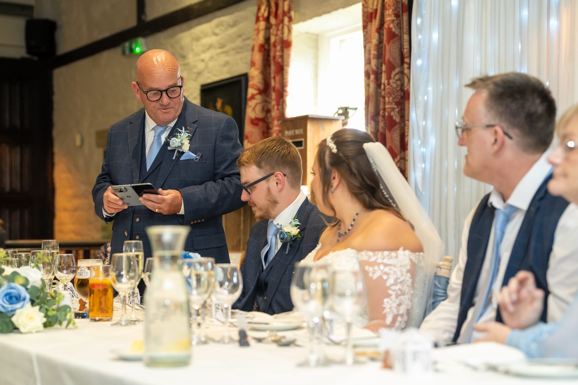 A speech at the top table before the wedding breakfast at Holdsworth House