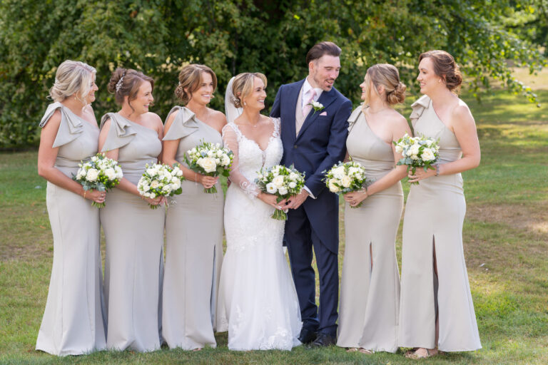 Bride, groom and bridesmaids photographed together at a Yorkshire wedding